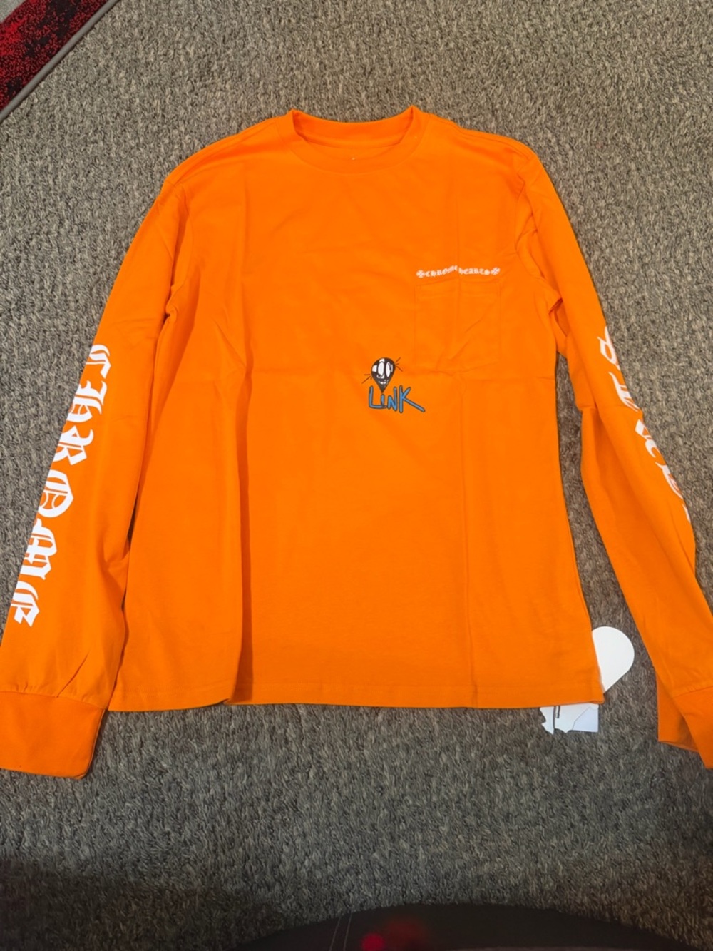Chrome Hearts x Matty Boy Link & Build Long Sleeve Thermal in orange. Men’s m
